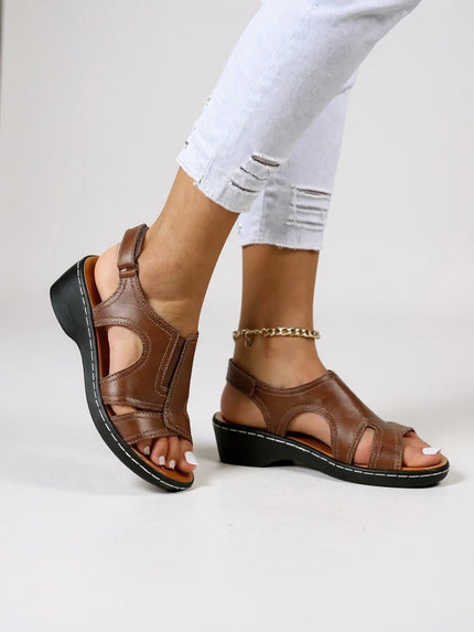 Brown leather peep toe wedge sandals with adjustable strap and black sole