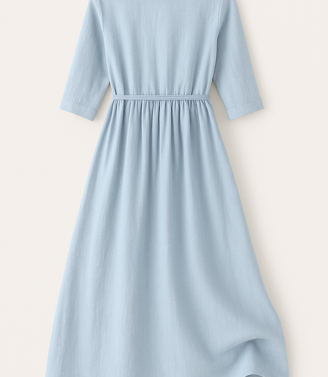 Back view of light blue cotton midi dress with gathered waist and three-quarter sleeves