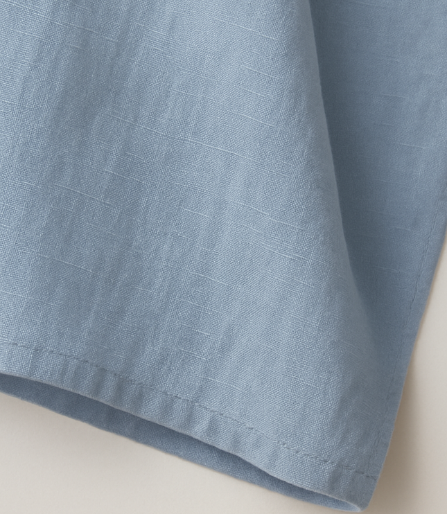 Close-up of light blue cotton fabric texture and weave detail