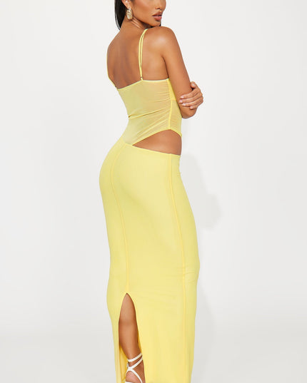 Back view of yellow maxi dress with ruched sides and cutout waist