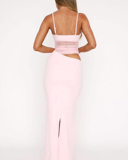 Back view of pink cut out maxi dress with spaghetti straps and open back