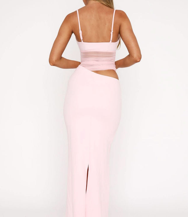 Back view of pink cut out maxi dress with spaghetti straps and open back
