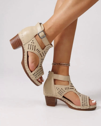 Beige cutout block heel sandals with ankle strap and linear perforated pattern