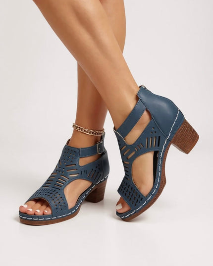 Navy blue cutout block heel sandals with ankle strap and perforated design