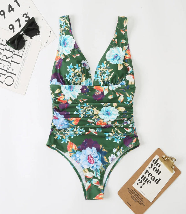 Green floral v-neck one piece bathing suit with light blue and orange flowers