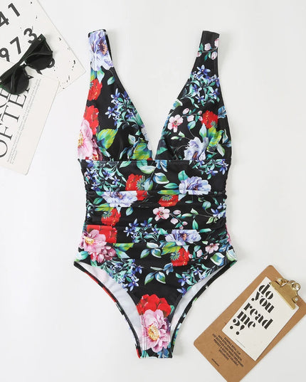 Black floral v-neck one piece bathing suit with ruched waist and colorful flowers
