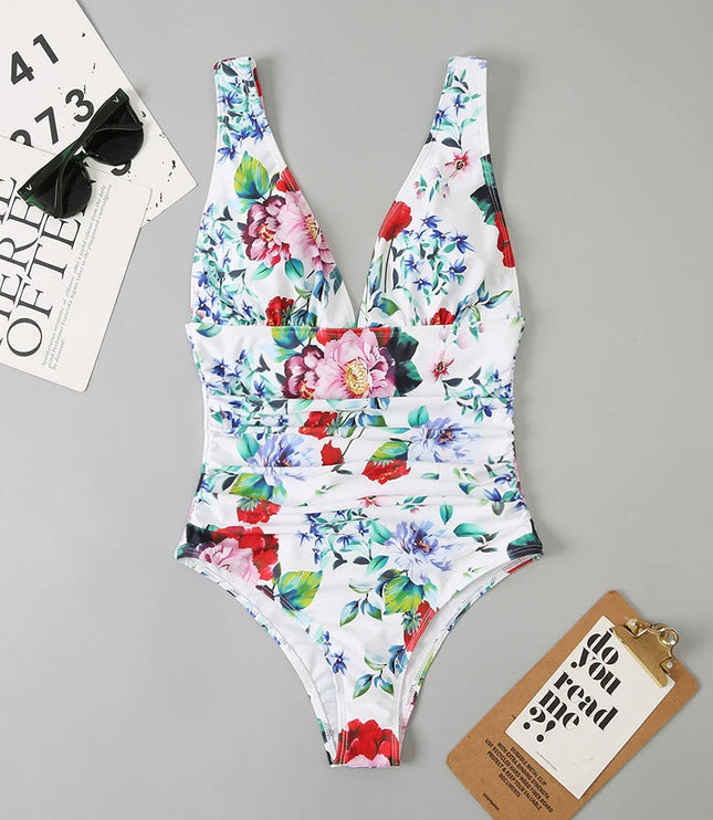 White floral v-neck one piece swimsuit with red and blue flower pattern
