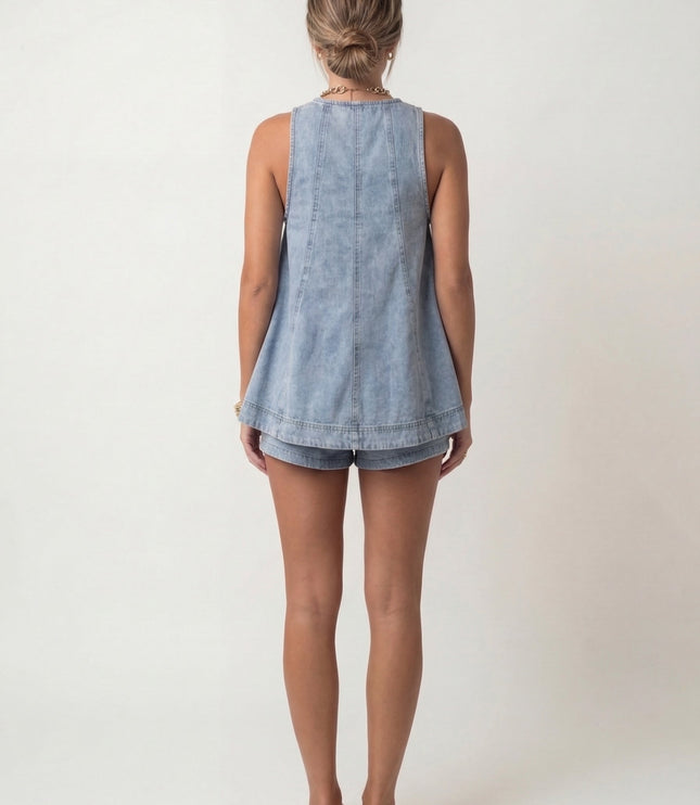 Back view of light blue denim tank top showing A-line cut and shorts