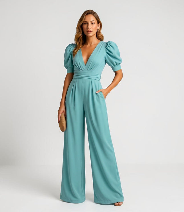 Teal wide leg jumpsuit with puff sleeves, deep V-neck, and gathered waist
