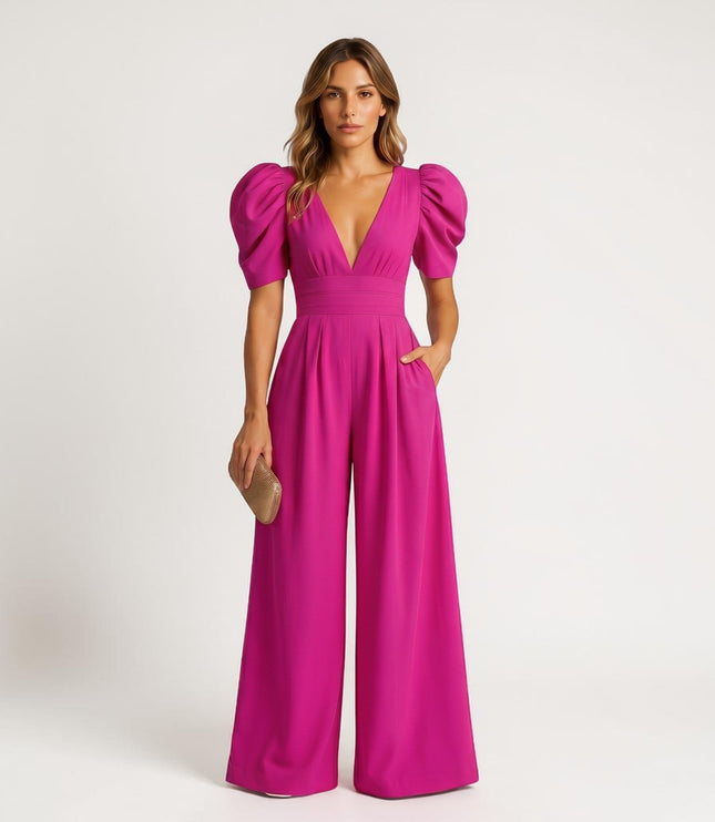 Magenta wide leg jumpsuit with puff sleeves, deep V-neck, and flowing legs