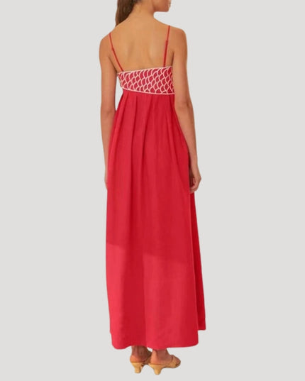 Back view of the red cami maxi sundress featuring white geometric embroidery across the upper back, full skirt.