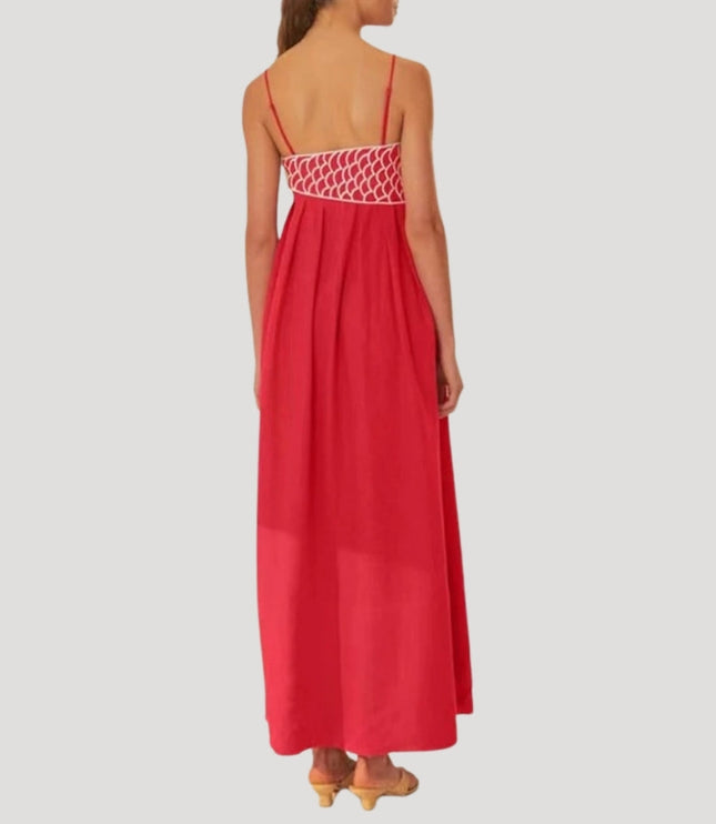 Back view of the red cami maxi sundress featuring white geometric embroidery across the upper back, full skirt.
