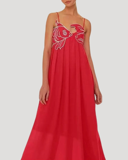 Red women's cami maxi sundress with white embroidered fish and crab detail on the bodice, flowing skirt.