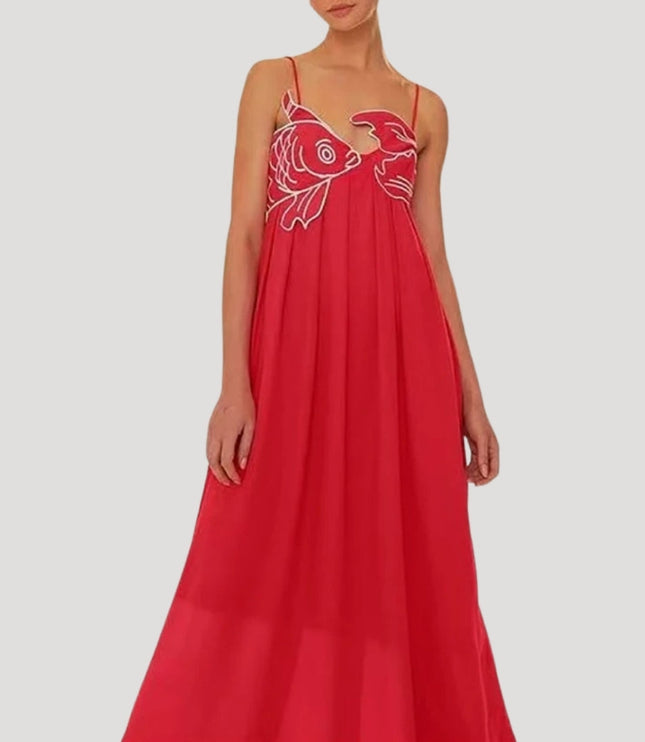 Red women's cami maxi sundress with white embroidered fish and crab detail on the bodice, flowing skirt.
