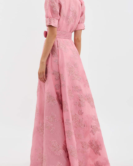 Back view of pink floral maxi dress with puff sleeves and full flowing skirt