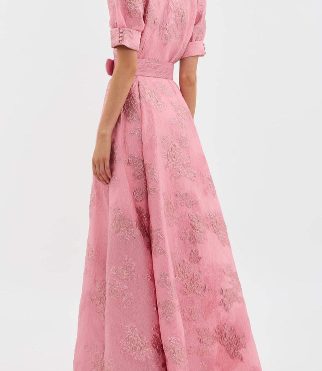 Back view of pink floral maxi dress with puff sleeves and full flowing skirt