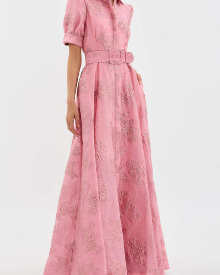 Side view of pink floral maxi dress showing belted waist and long A-line skirt