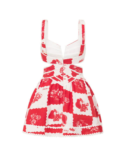 Flat lay back of red floral mini dress showing pearl-trimmed cutout pattern
