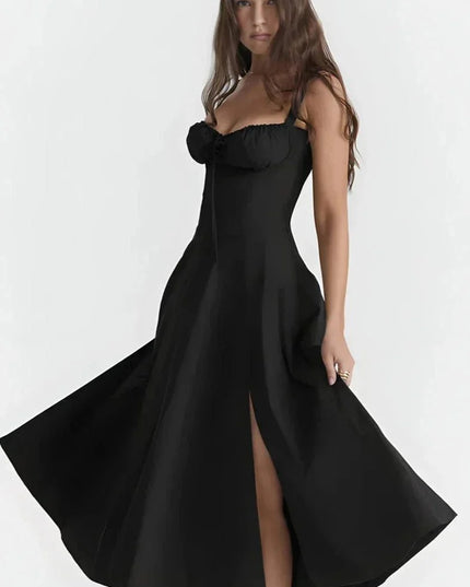 Black midi dress with spaghetti straps, ruched bust, and thigh-high slit for a fitted summer dress look