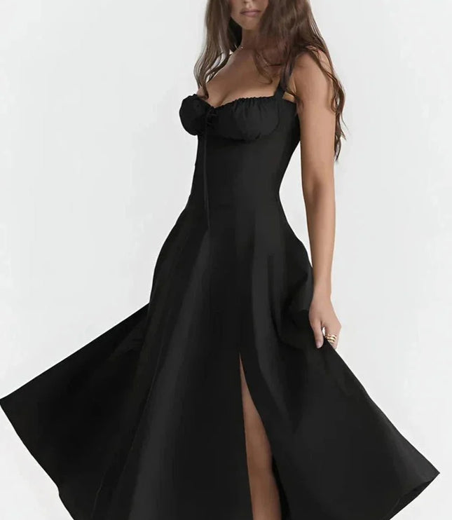 Black midi dress with spaghetti straps, ruched bust, and thigh-high slit for a fitted summer dress look