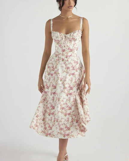 White floral midi dress with pink print, sweetheart neckline, and fitted corset-style bodice
