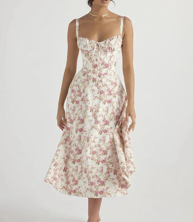 White floral midi dress with pink print, sweetheart neckline, and fitted corset-style bodice