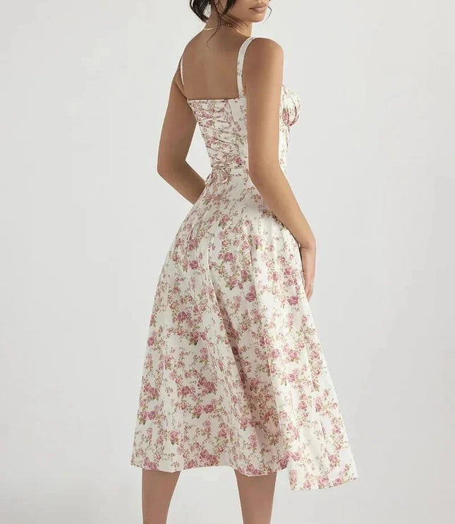 Back view of white floral midi dress with pink flowers, straps, and flared midi skirt