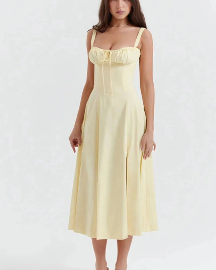Pale yellow floral midi dress with ruched bust, wide straps, and flared skirt