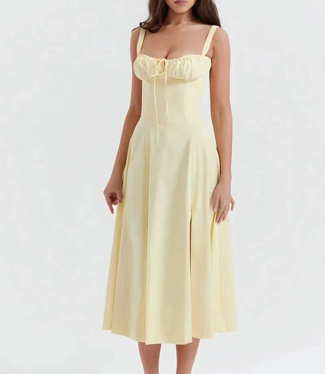 Pale yellow floral midi dress with ruched bust, wide straps, and flared skirt