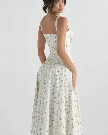 Back view of white floral midi dress with open back and wide shoulder straps