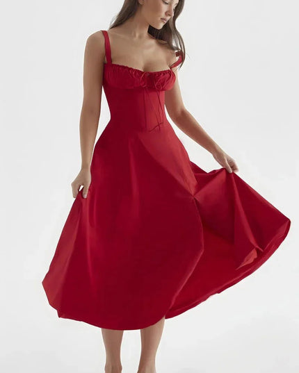 Red midi dress held out to show full skirt, fitted bodice, and shoulder straps