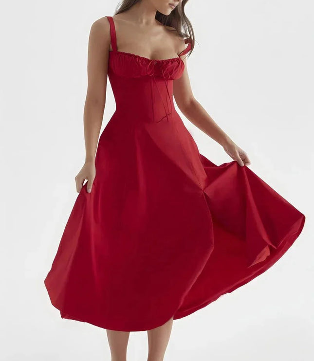 Red midi dress held out to show full skirt, fitted bodice, and shoulder straps