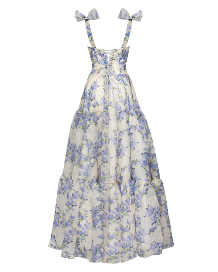 Back view of blue floral maxi dress with lace-up corset and bow shoulder straps