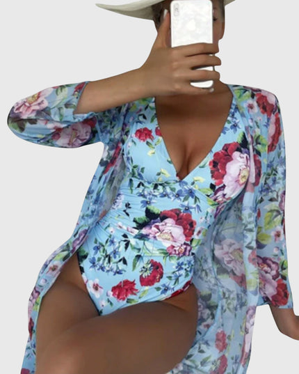 Light blue floral designer swimsuit with long-sleeve wrap showing wrap detail