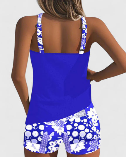 Back view of royal blue tankini with white daisy print shorts