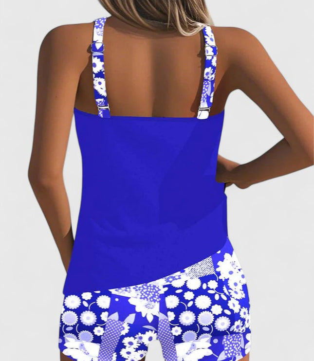 Back view of royal blue tankini with white daisy print shorts