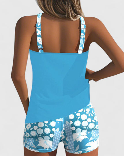 Turquoise tankini with white floral print shorts back view