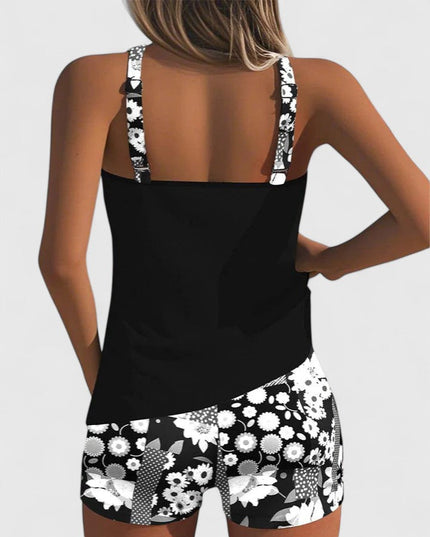 Back view of black tankini with white floral print shorts