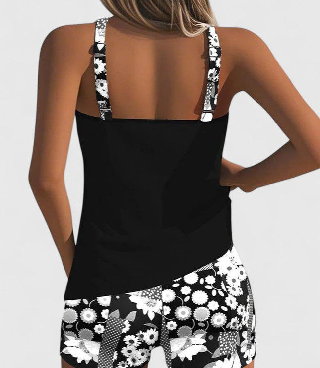 Back view of black tankini with white floral print shorts