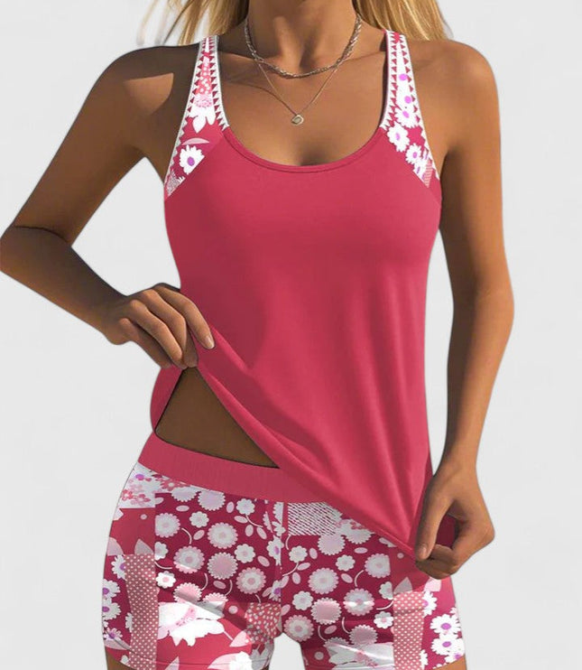 pink tankini with white floral print straps and shorts front view