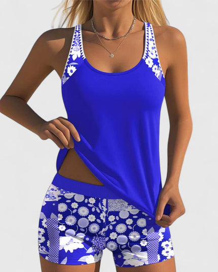 Royal blue tankini with white floral print straps and matching shorts front view