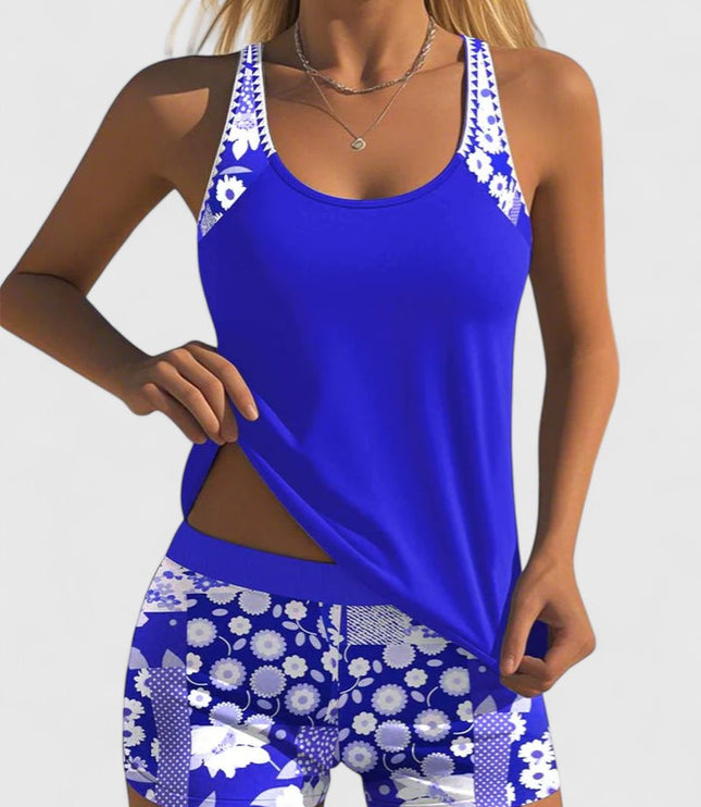 Royal blue tankini with white floral print straps and matching shorts front view