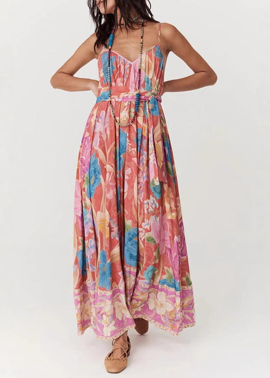 Full-length front view of a women's floral print V-neck maxi sundress, cinched at the waist, with a detailed floral hem.