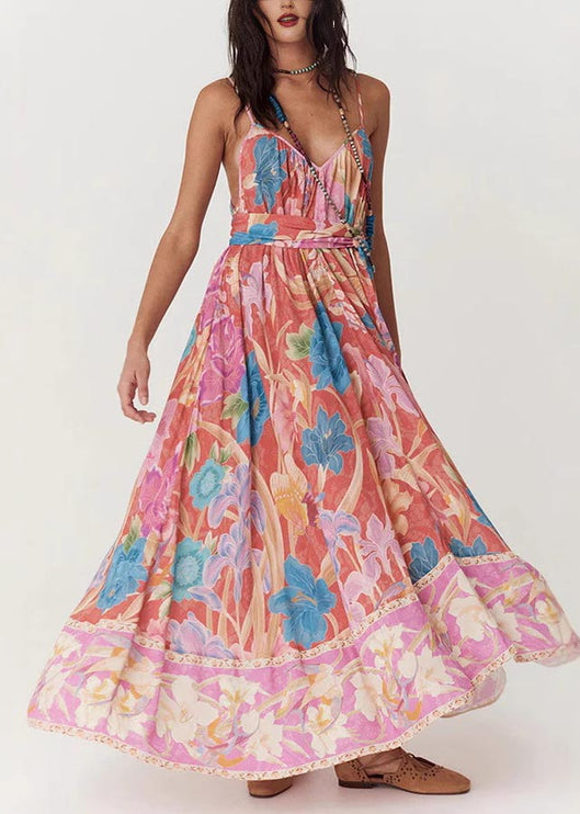 Side view of a women's floral print V-neck maxi sundress with a flowing skirt, showcasing the vibrant floral design.
