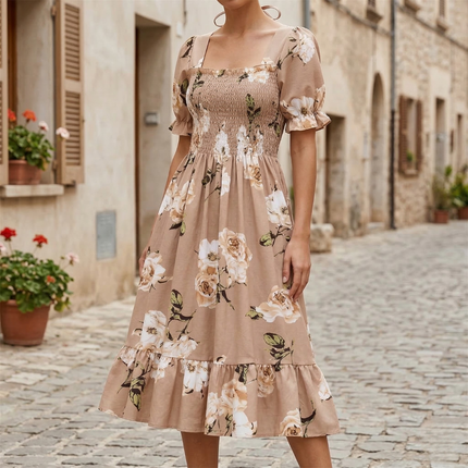 Beige floral midi dress with square neck, puff sleeves, and smocked bodice on a model