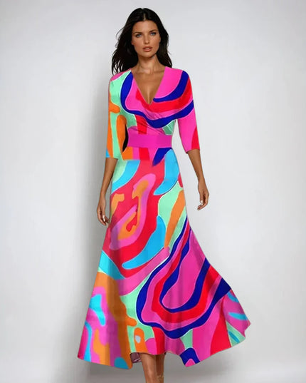 Colorful floral maxi dress with V neck, three quarter sleeves, and vibrant abstract print