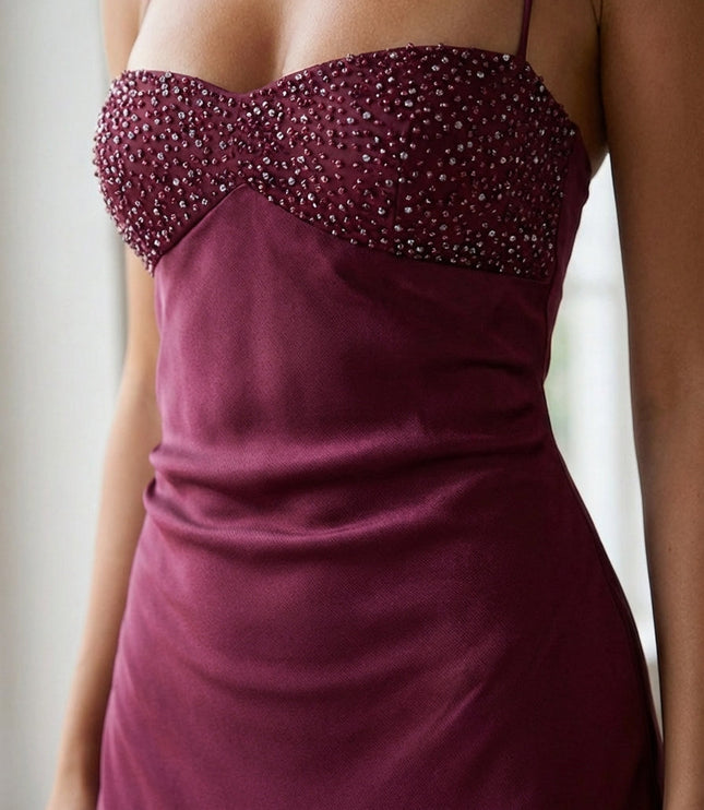 Close-up of burgundy beaded sweetheart bodice with crystal embellishments