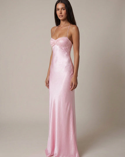 Side view of pink formal halter maxi dress with beaded bodice