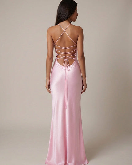 Back view of pink halter maxi dress showing lace-up strappy detail