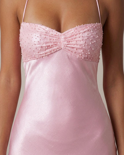 Close-up of pink beaded sweetheart bodice with pearl embellishments